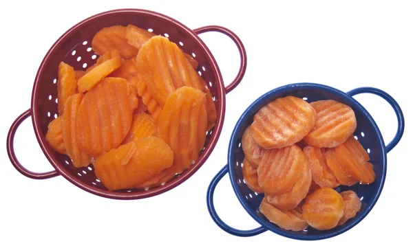 Färska och frysta morötter — Stockfoto