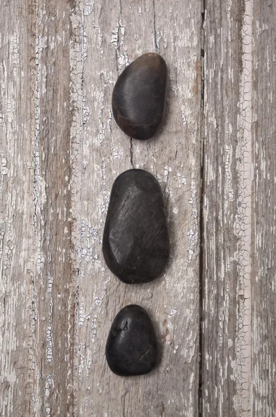 Zen Massage Stones on Rustic Wood — Stock Photo, Image