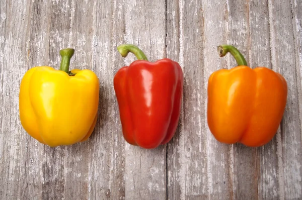 Vibrant Peppers on Rustic Wood — Stock Photo, Image