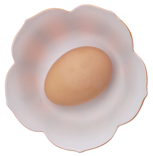 Bruin ei in een kom — Stockfoto