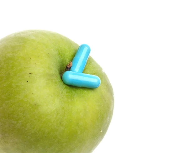 Pomme verte avec pilules — Photo