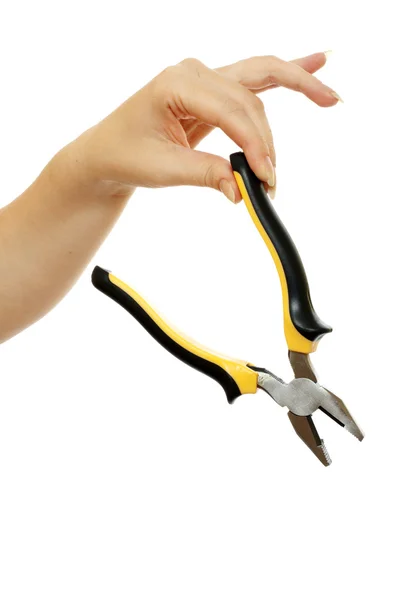 Pliers in a beautiful female hand — Stock Photo, Image