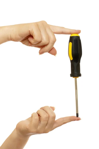 Screwdriver in a beautiful female hands — Stock Photo, Image