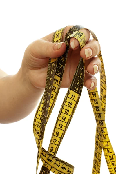 Tape measure in a beautiful female hand — Stock Photo, Image