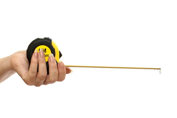 Tape-measure in a beautiful female hand — Stock Photo, Image