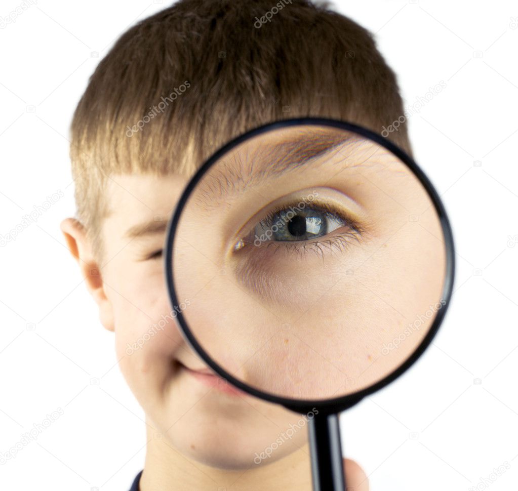 Kid using magnifying glass