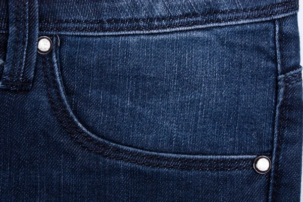 Bolsillo delantero de jeans con la tableta de cuero —  Fotos de Stock