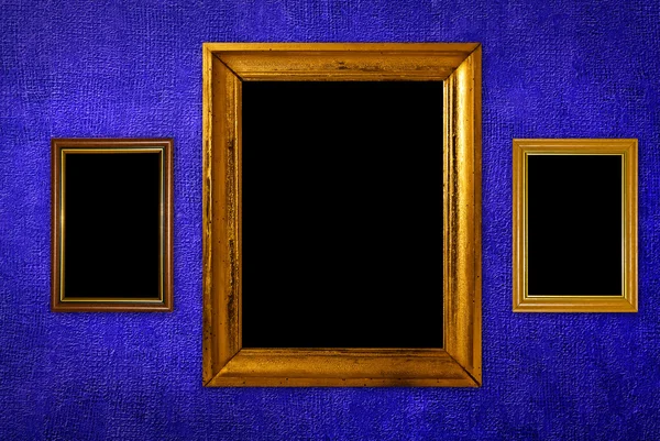 Alte Rahmen über blauer Tapete — Stockfoto