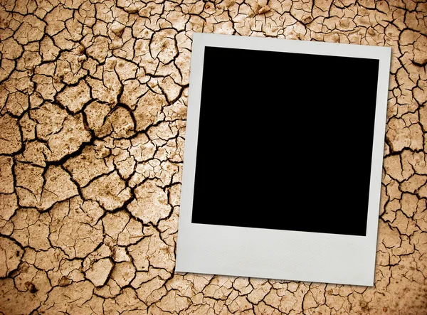 stock image Photo card on cracked ground