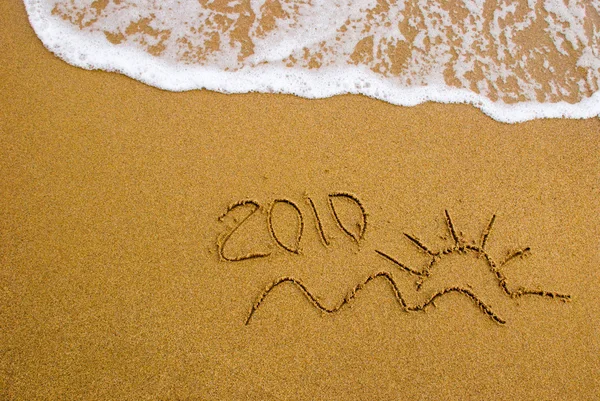 År 2010 skrivit på sanden — Stockfoto