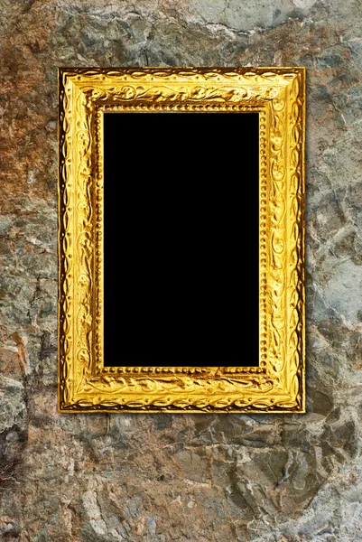 石头背景上的金色框 — 图库照片