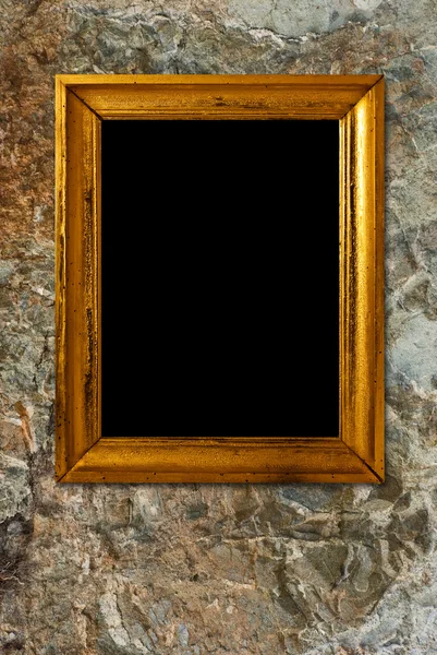 Gouden frame op een stenen achtergrond — Stockfoto