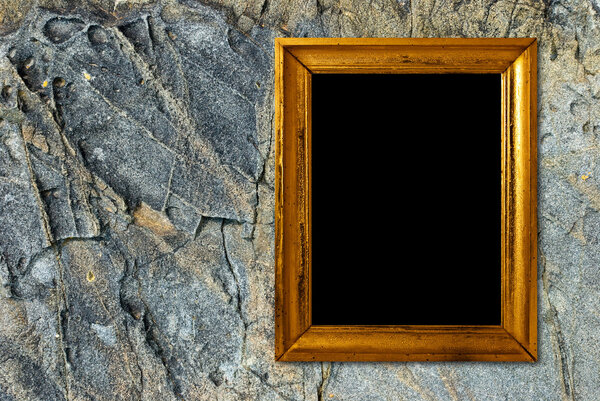 Gold frame on a stone background