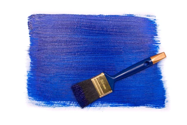 Professional brush with blue paint on a white ba — Stock Photo, Image