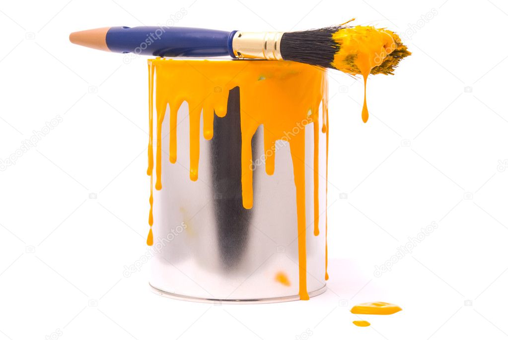 Can of yellow paint and brush