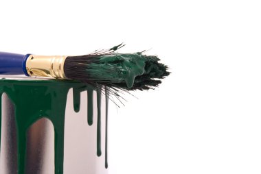 Can of green paint and professional brush on a w clipart