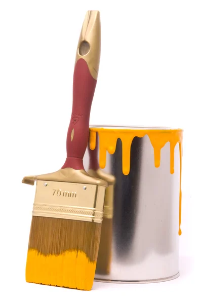 Can of yellow paint and professional brush — Stock Photo, Image