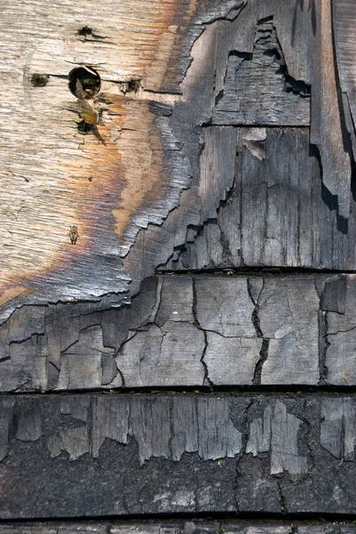 stock image The scorched wooden background.