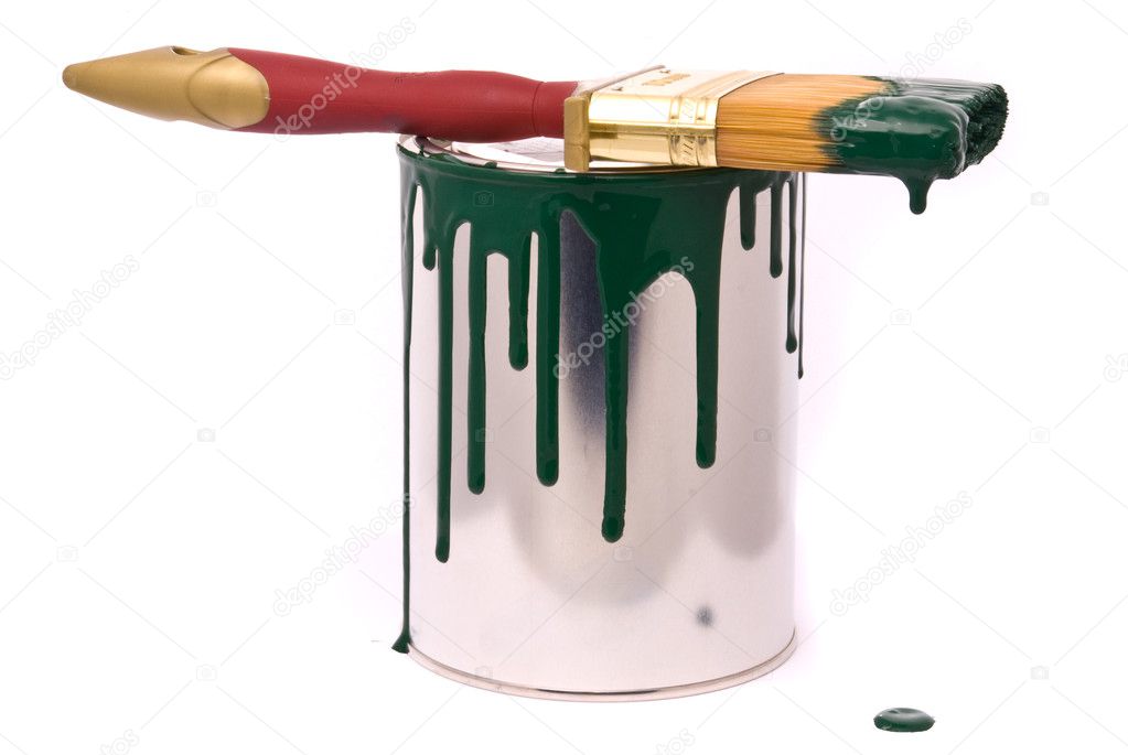 Can of green paint and brush