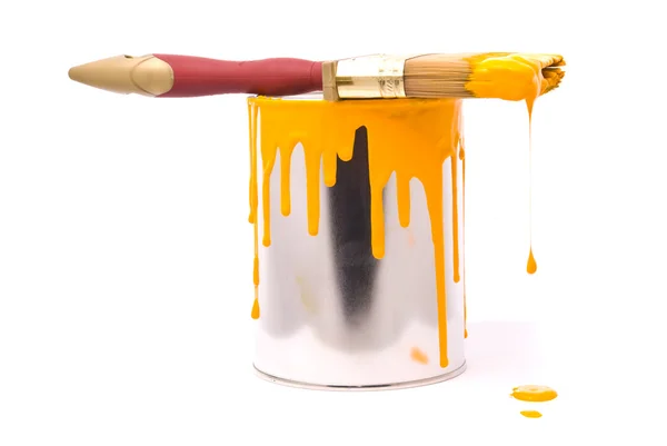Can of yellow paint and professional brush — Stock Photo, Image