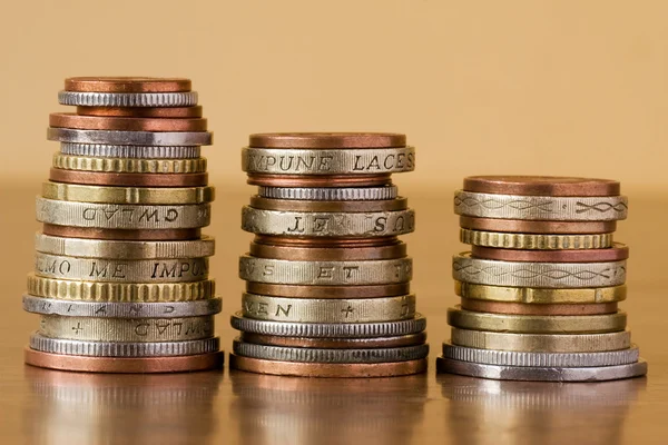 Tři hromádky mincí — Stock fotografie