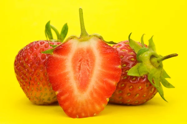 Strawberries isolated on yellow background — Stock Photo, Image