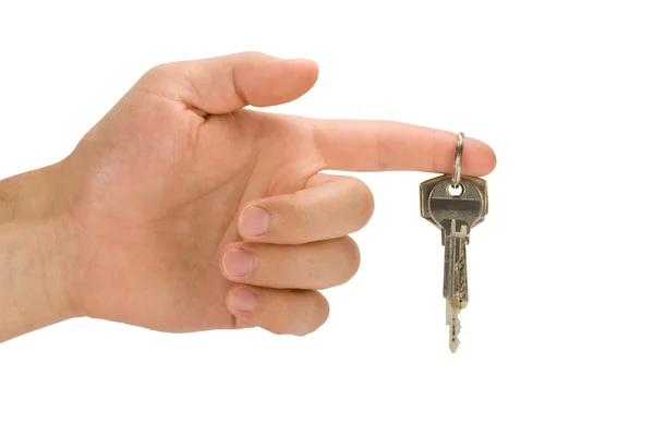 Hand with keys on forefinger — Stock Photo, Image