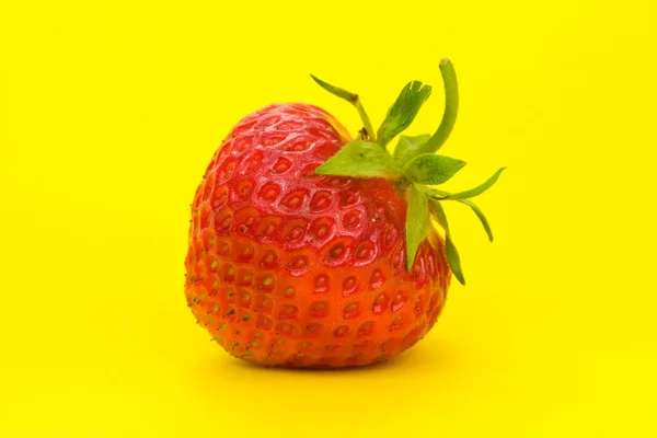 Strawberry isolated on yellow background — Stock Photo, Image