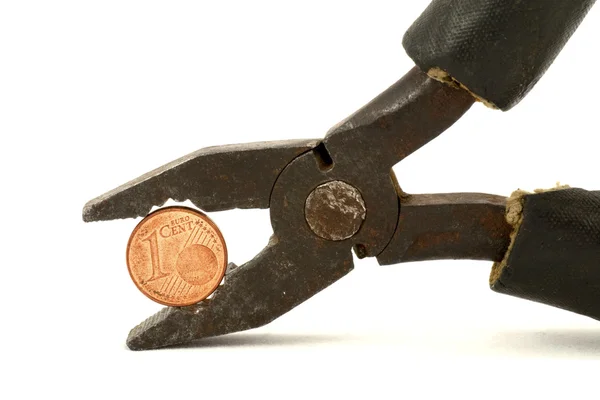 Stock image Euro cent tightly squeezed in pliers