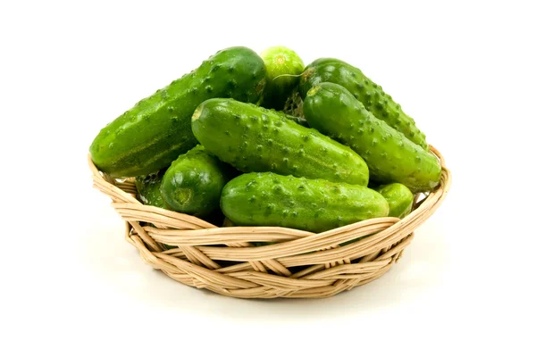 Wicker dish with cucumbers — Stock Photo, Image