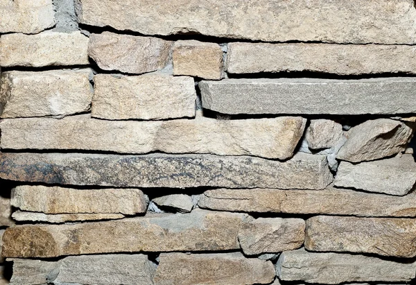 Stenen muur, plat gestapeld achtergrond en textuur — Stockfoto