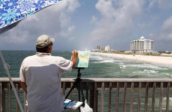 Kunstenaar schilderij shorefront — Stockfoto