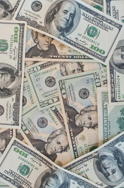 Hromada peněz od 20 a 100 dolarové bankovky — Stock fotografie