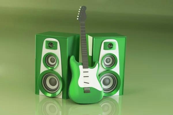 Gitara i louspeakers na zielonym tle — Zdjęcie stockowe