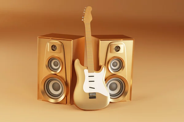 Golden guitar and louspeakers on yellow background — Stock Photo, Image