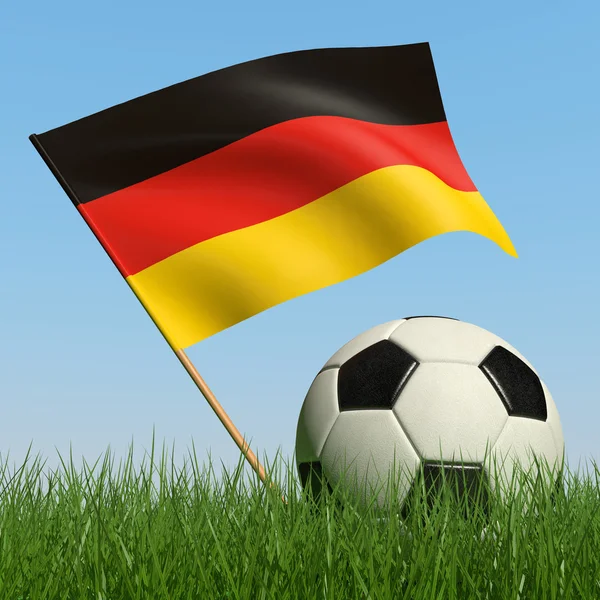 Bola de futebol na grama e bandeira da Alemanha — Fotografia de Stock