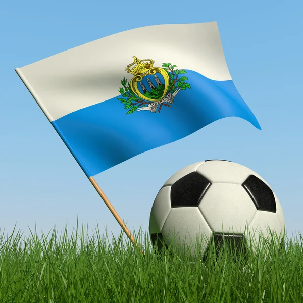 Pelota de fútbol en la hierba y la bandera de San Marino . — Foto de Stock