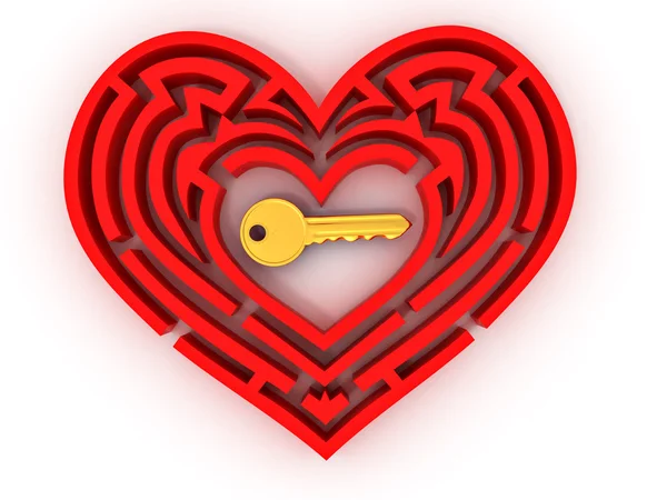 Ключ в центре лабиринта в форме сердца — стоковое фото