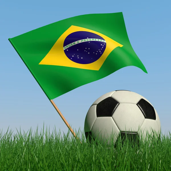 Balón de fútbol en el césped y la bandera de Brasil —  Fotos de Stock