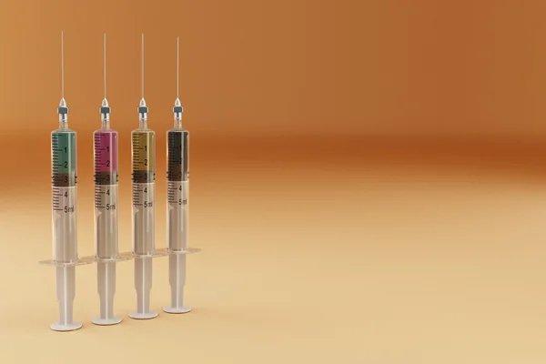 Four syringe with paints. CMYK — Stock Photo, Image