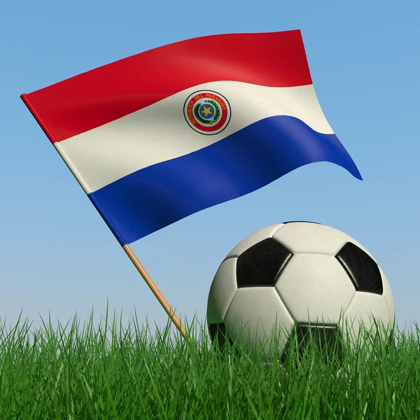 Balón de fútbol en el césped y la bandera de Paraguay —  Fotos de Stock