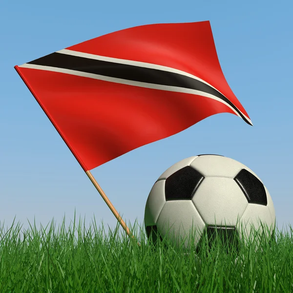 Μπάλα ποδοσφαίρου στα λιβάδια και τη σημαία του Τρινιντάντ και Τομπάγκο — Φωτογραφία Αρχείου