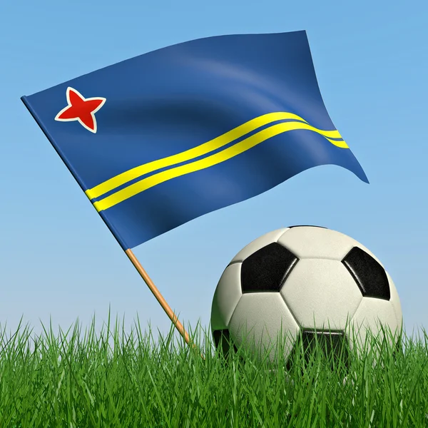Bola de futebol na grama e a bandeira de Aruba — Fotografia de Stock