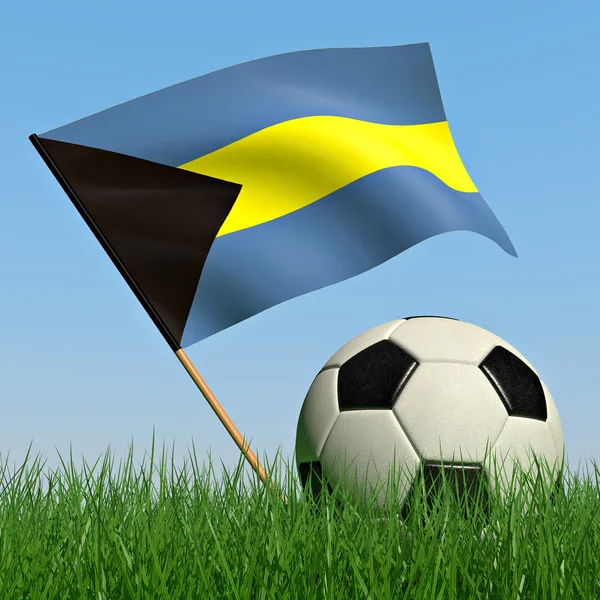 Bola de futebol na grama e a bandeira das Bahamas — Fotografia de Stock