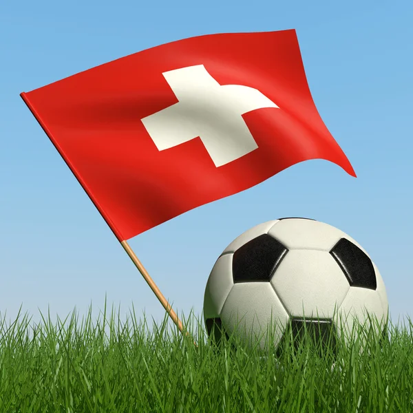 Bola de futebol na grama e bandeira da Suíça . — Fotografia de Stock