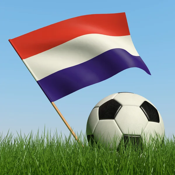 Voetbal in het gras en de vlag van Luxemburg. — Stockfoto