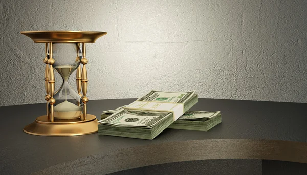 Timglas och pengar på skrivbordet — Stockfoto