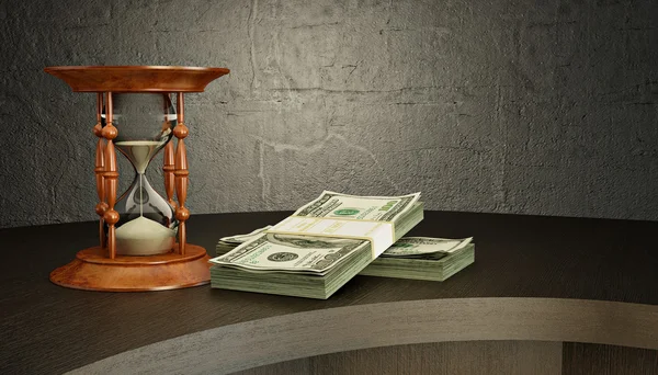 Reloj de arena y dinero en el escritorio —  Fotos de Stock