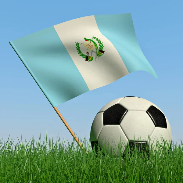 Bola de futebol na grama e a bandeira da Guatemala — Fotografia de Stock