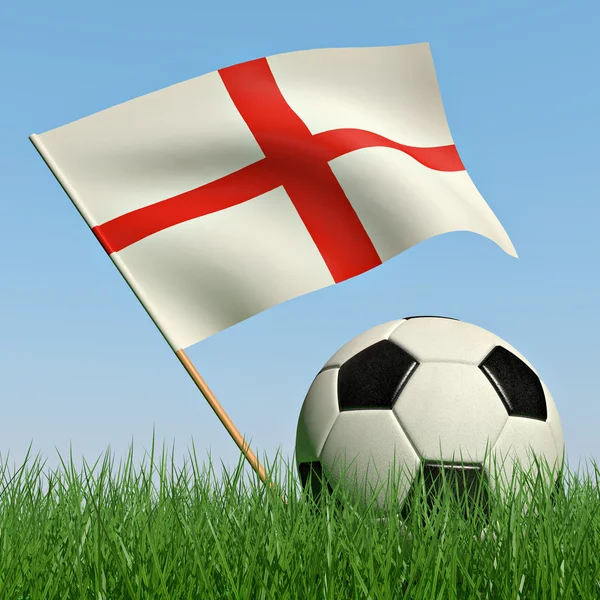 Bola de futebol na grama e a bandeira da Inglaterra — Fotografia de Stock